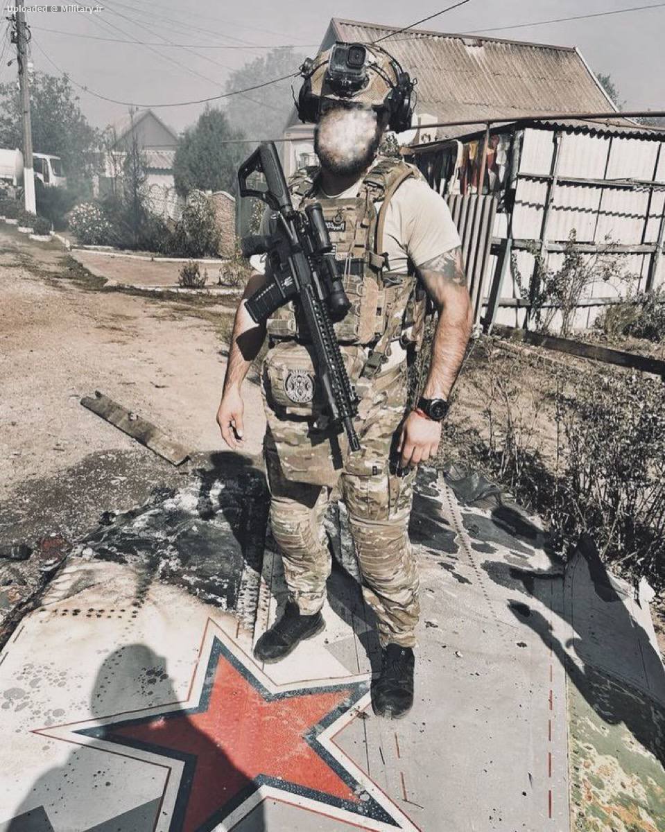 Ukrainian_soldier_stands_on_the_remains_