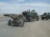 thumb_800px-M1114_towing_M102_Howitzer.J